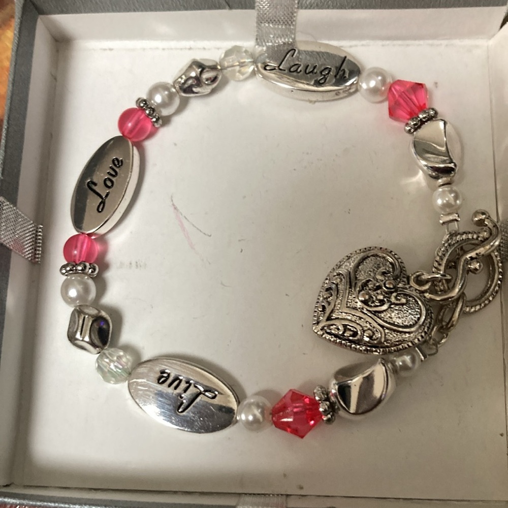Bracelet approximately 8-8 1/2 inches long. Never been worn.